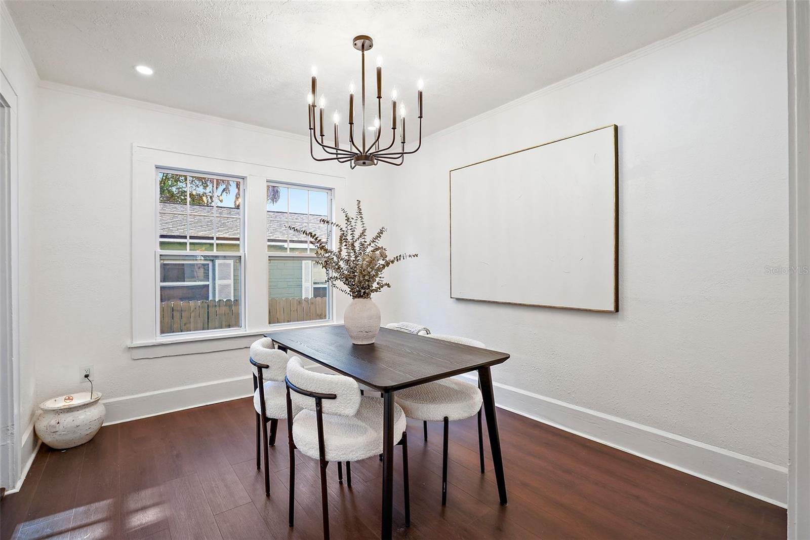 Dining room features original 1920's casework and chandelier inspired by that time era
