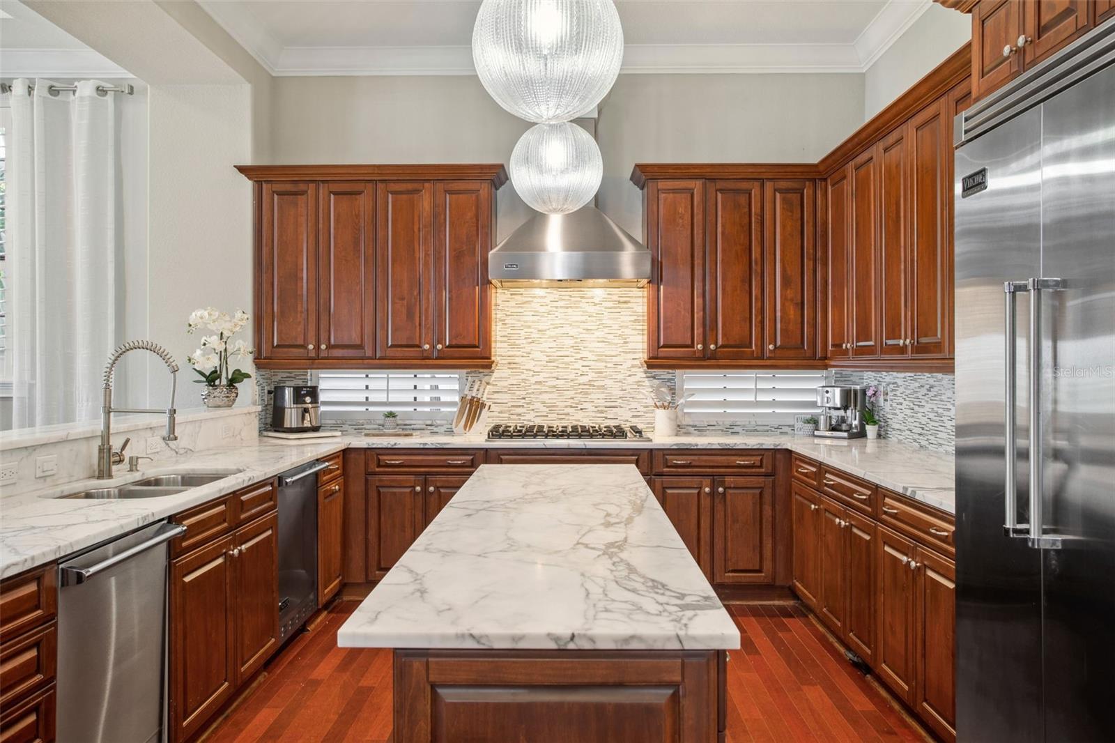 Easily entertain in this gourmet kitchen with stunning quartz countertops.