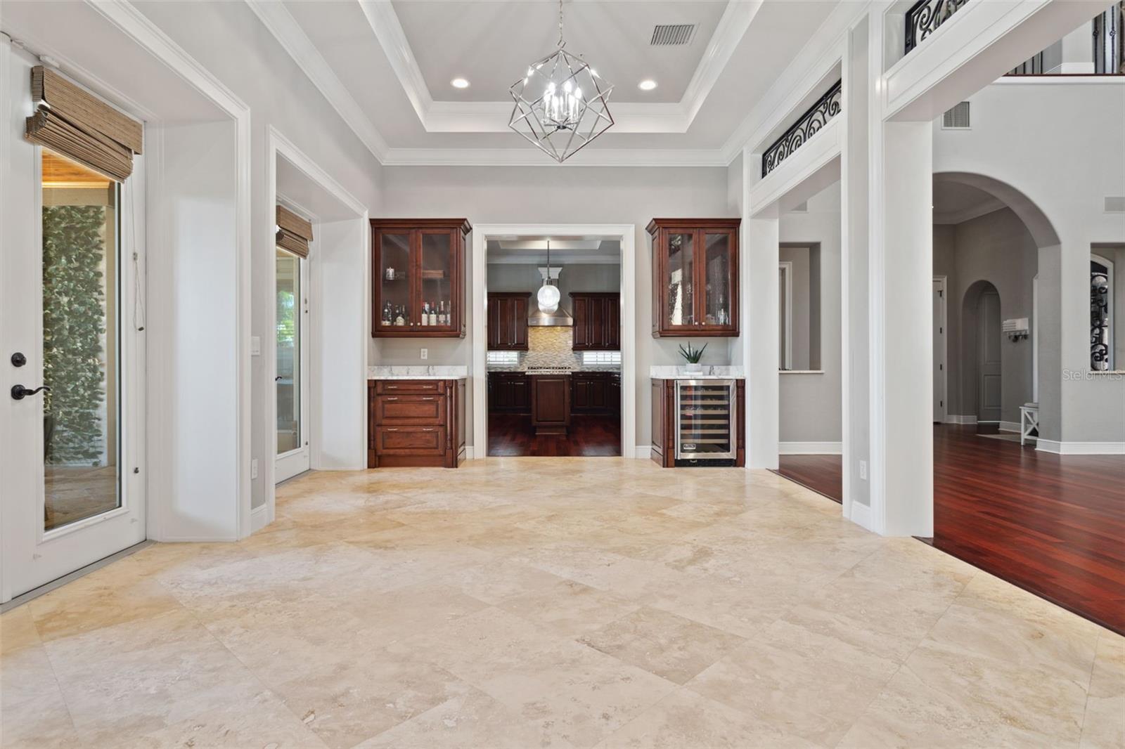 Formal dining room with built-ins and beverage cooler.