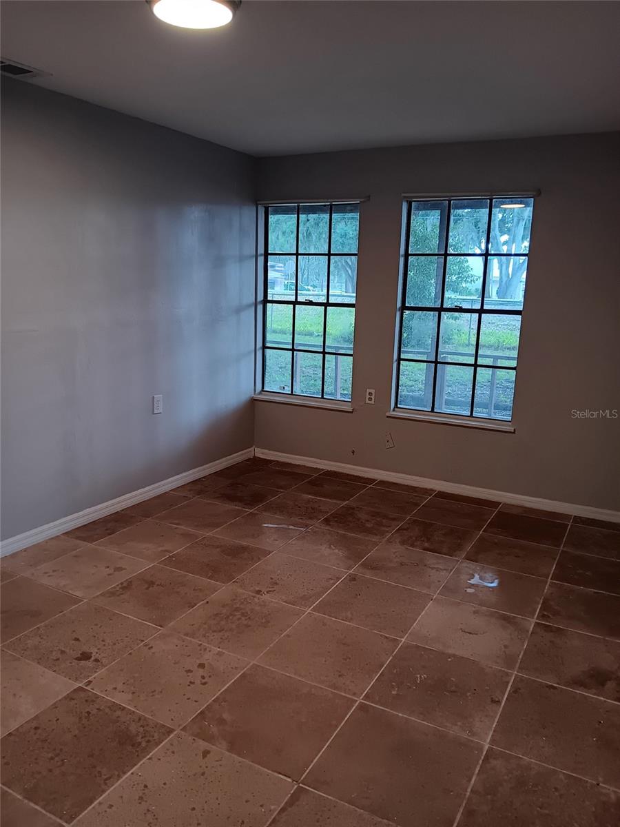 3rd bedroom with expensive travertine flooring