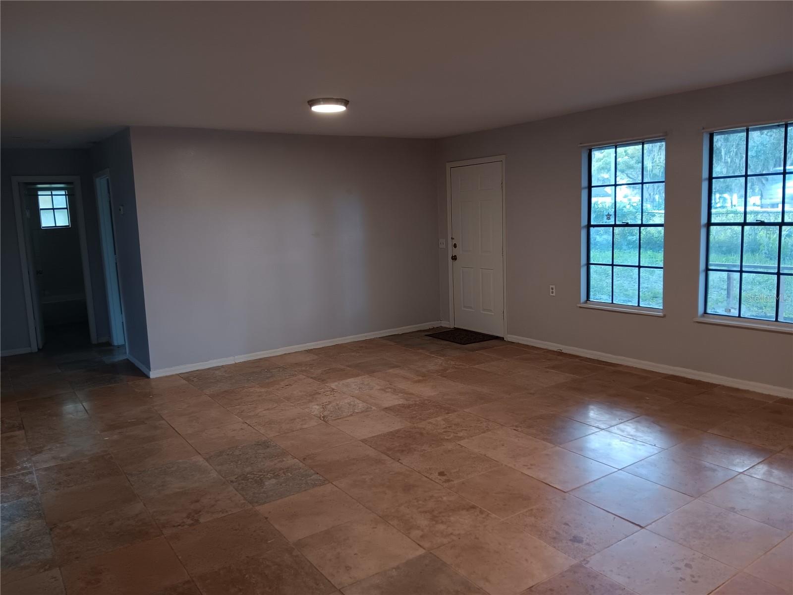 living room with expensive travertine flooring