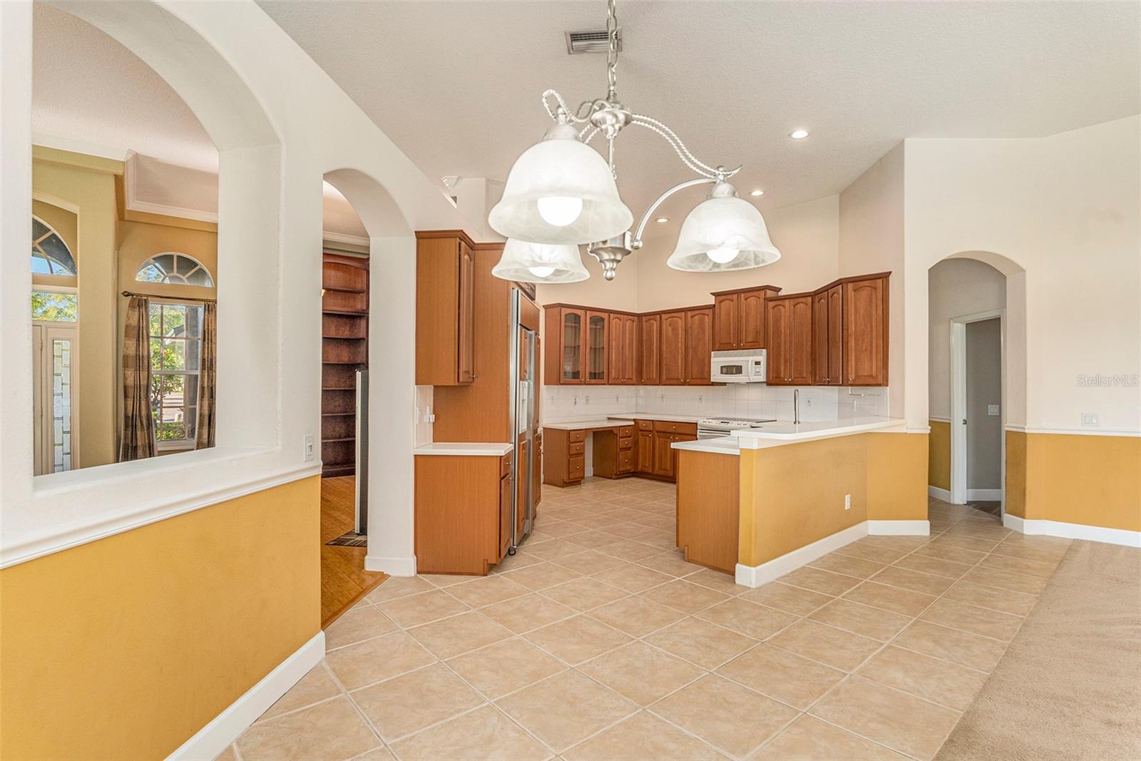 The spacious kitchen is the heart of this open and airy floor plan