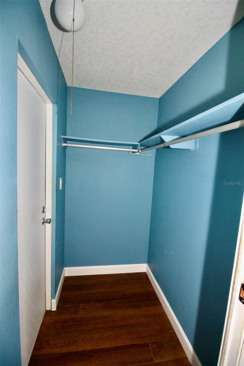 Primary Bedroom Closet, Door to the back yard and emergency exit.