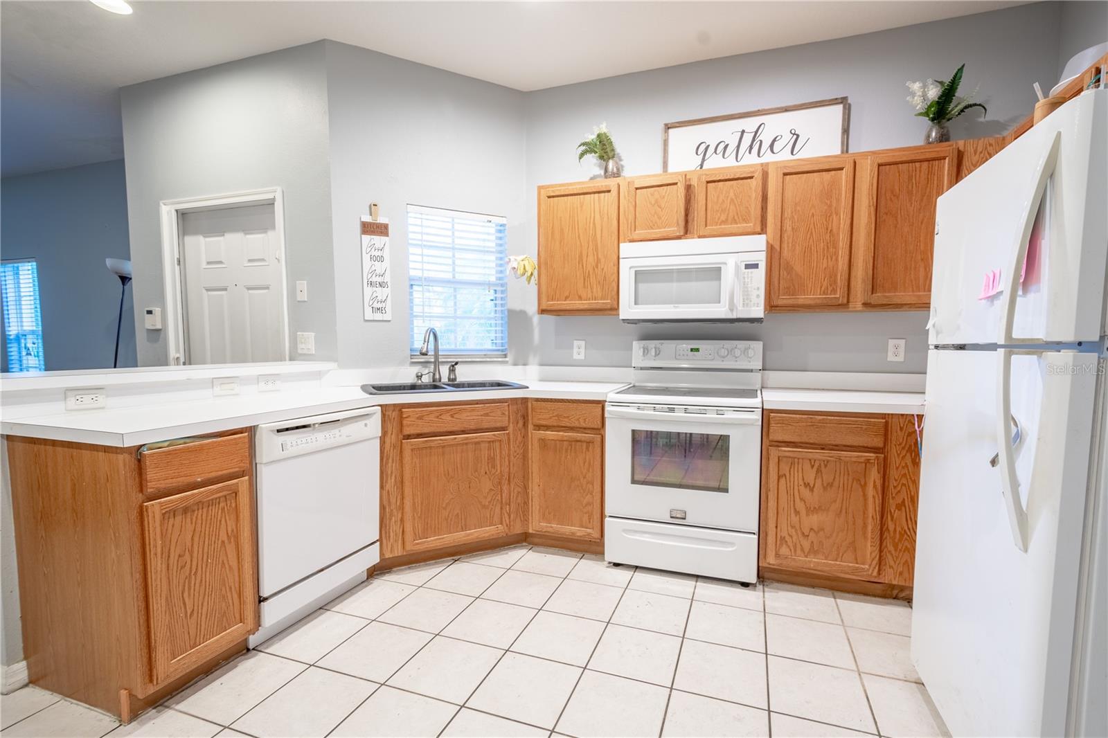 Solid counters and ceramic tile flooring make kitchen clean up a breeze.