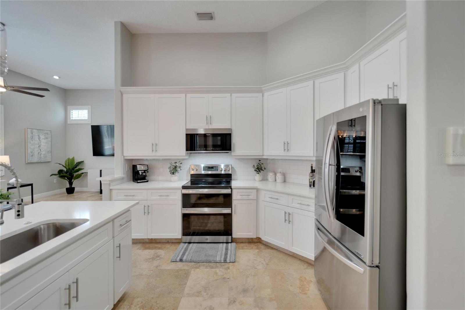 Gourmet kitchen with breakfast bar and large walk in pantry