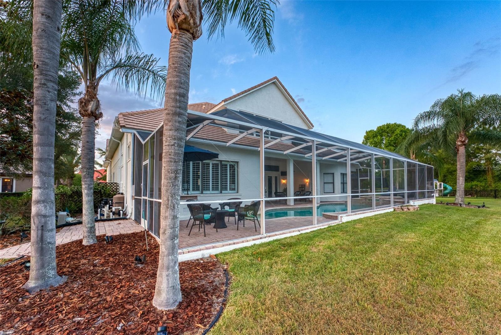 YOUR BACKYARD LIFESTYLE WITH PALM TREES AND EXPANSIVE BACKYARD
