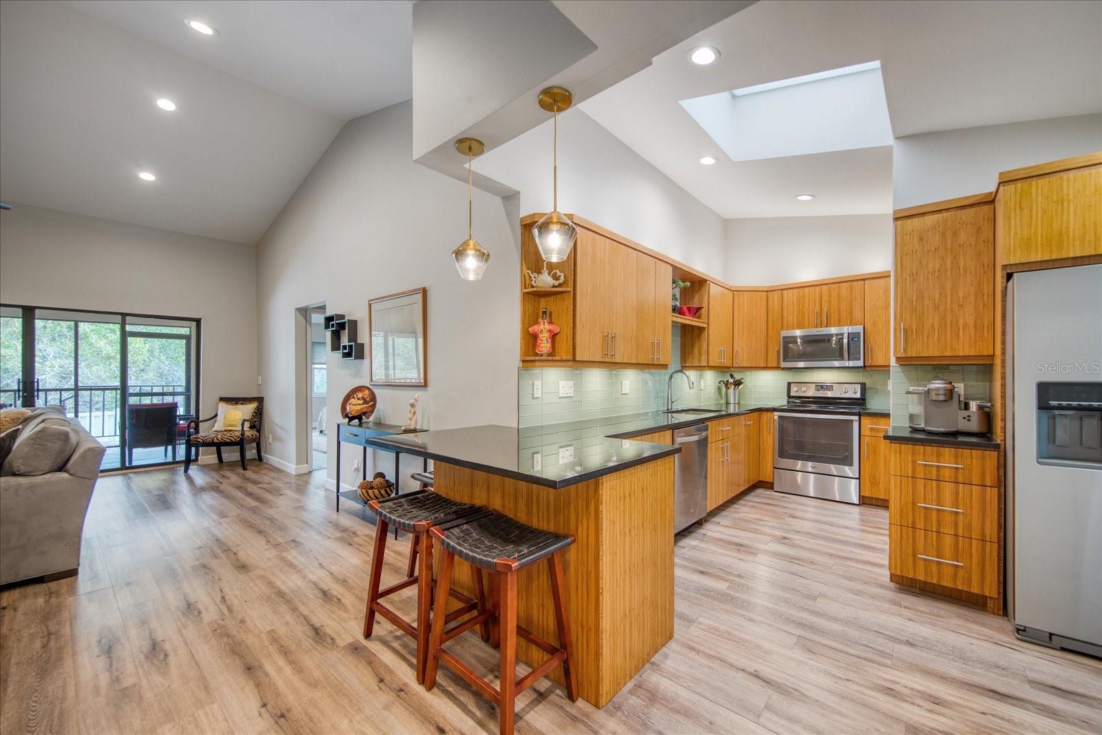 Updated from top to bottom--gorgeous remodeled kitchen, luxury vinyl plank flooring throughout the entire home, recessed lighting, solid wood cabinetry & granite countertops.