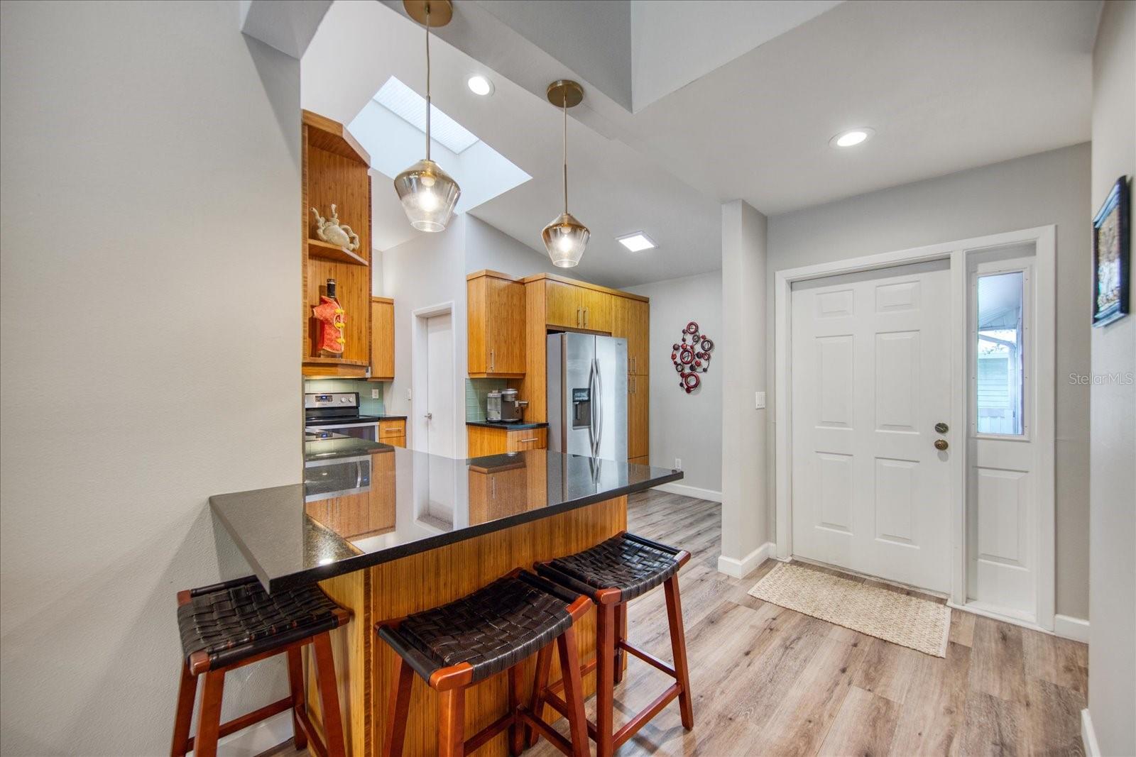 Breakfast bar area and the front entrance.