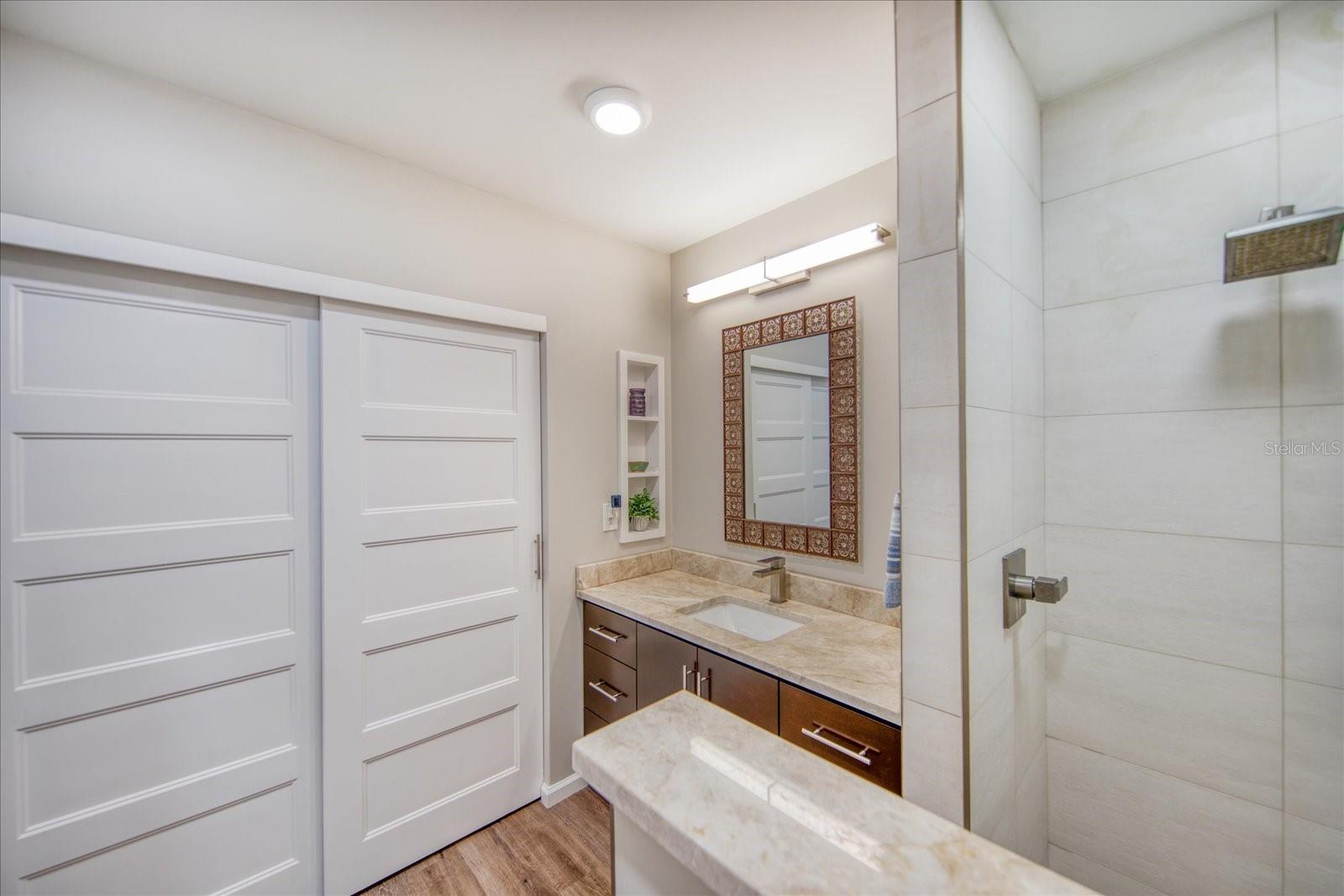 Large tiled shower in the 2nd bathroom and newer closet doors.