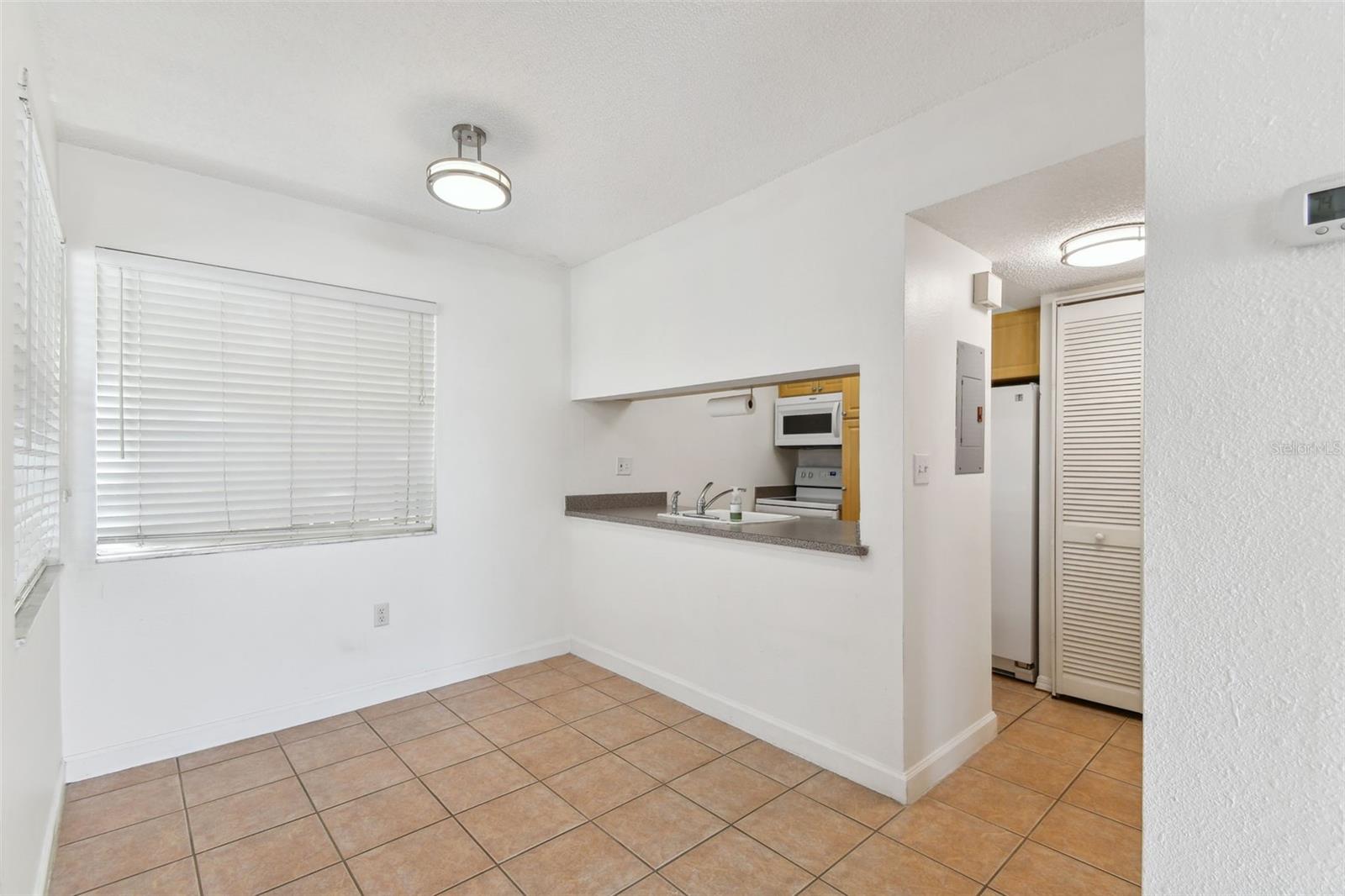 One bedroom condo, with laminate flooring and sliders for extra light.