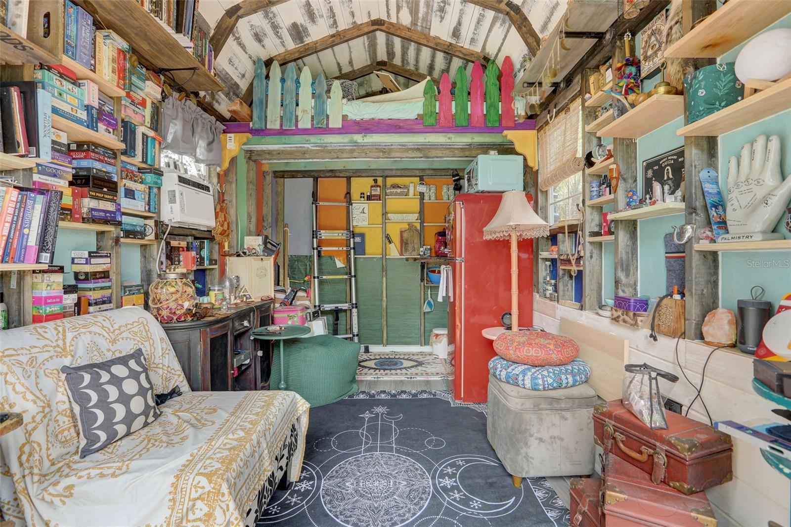 inside "SHE" shed with loft bed, electricity, and AC