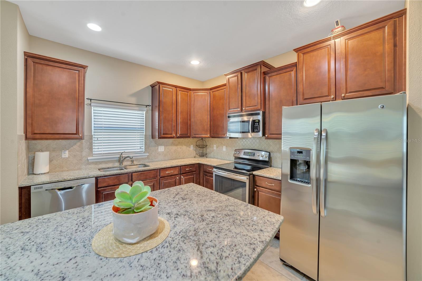 TUBE LIGHTING ENHANCES THE KITCHEN WORK AREA.