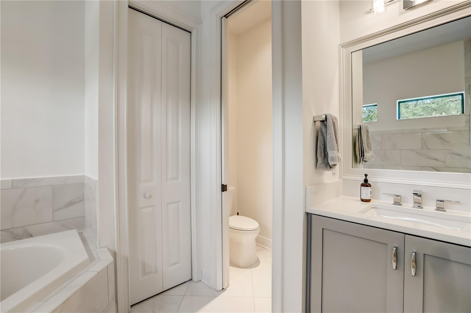 Owners suite bathroom with dual vanities, 2 person soaking tub and walk-in shower & water closet