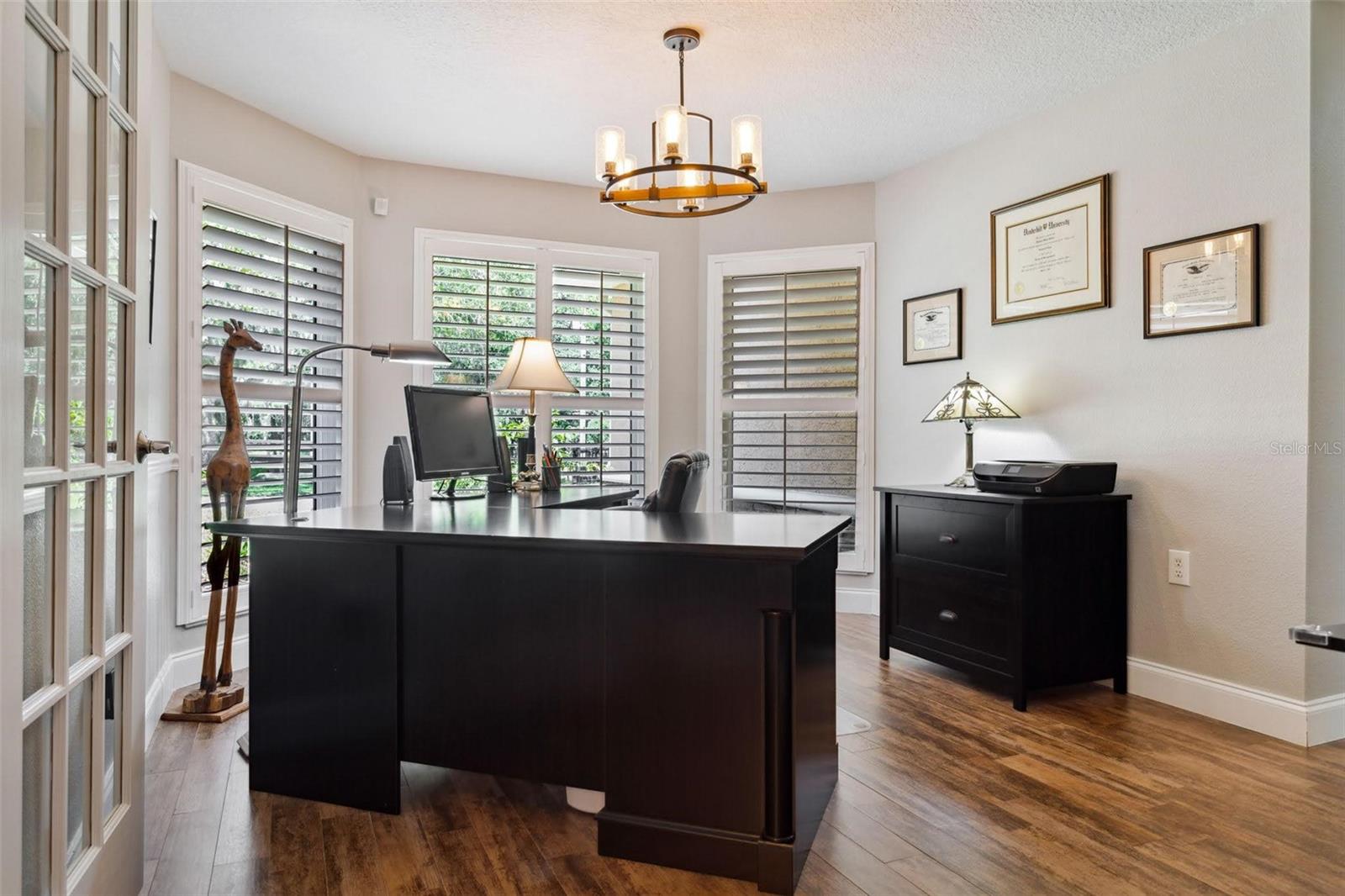 This room just off of the Foyer and adjacent to the Family Room is currently used as an office, but could be used as your formal dining room. Beautiful French doors and plantation shutters.