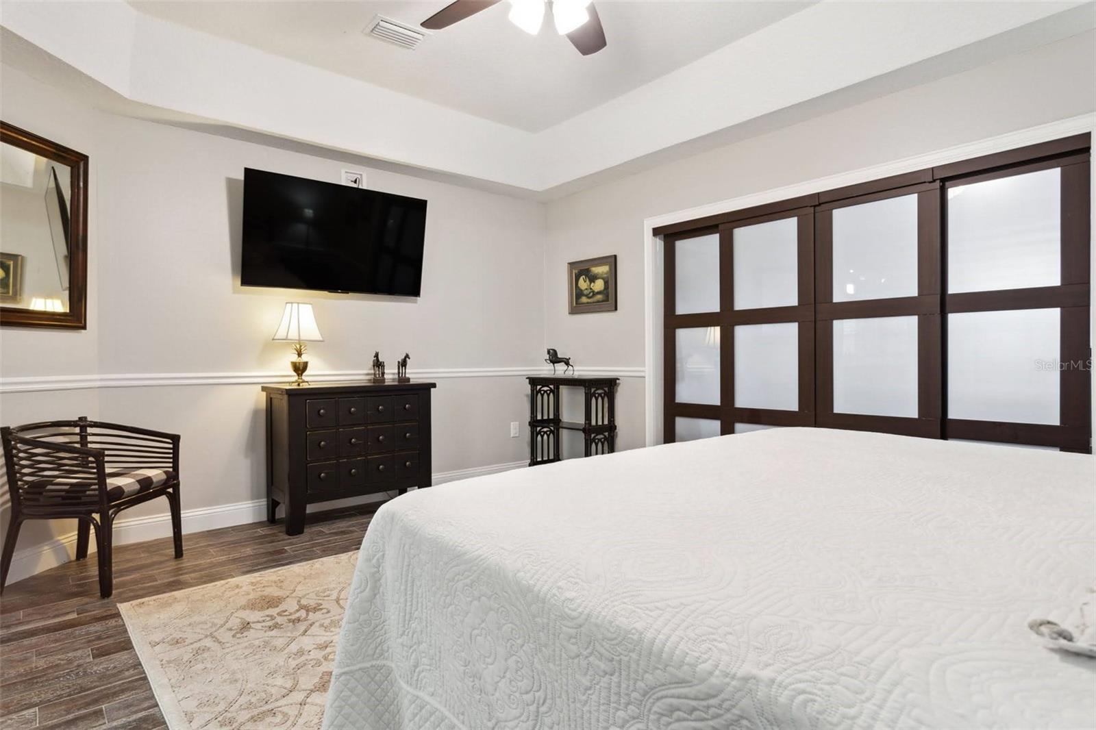 Beautiful master bedroom with cali-sliders into the expansive his and hers master closet.