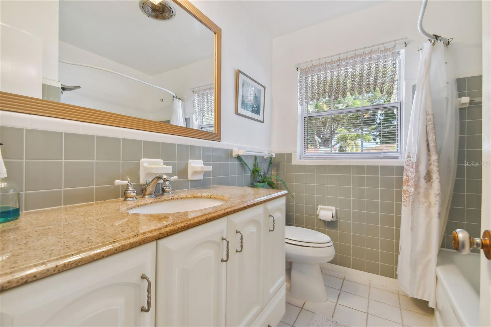 Hall Bathroom, granite counter top, tub, fresh and clean
