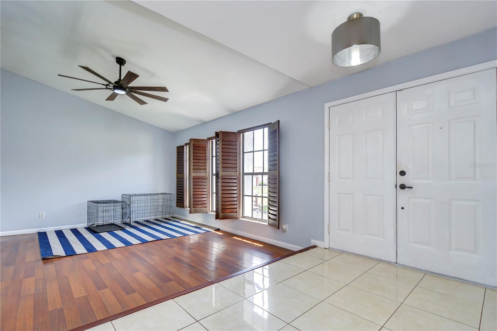 Formal living room with plantation shutters is the perfect spot to entertain!