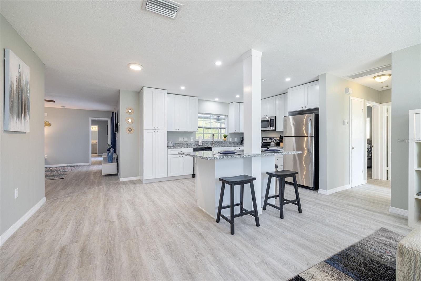 Modern Kitchen with shaker cabinets, granite counter tops, and stainless steel appliances