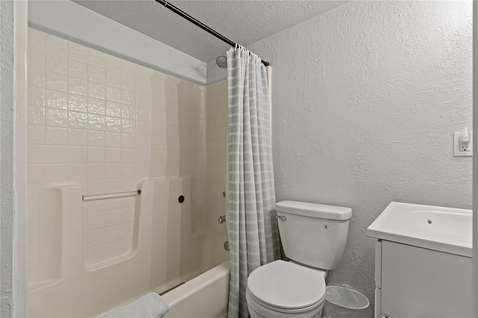TUB & SHOWER COMBO IN THE DOWNSTAIRS GUEST BATHROOM!