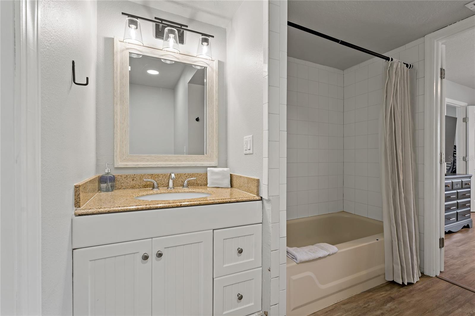 PRIMARY BATHROOM WITH SHOWER/TUB COMBO