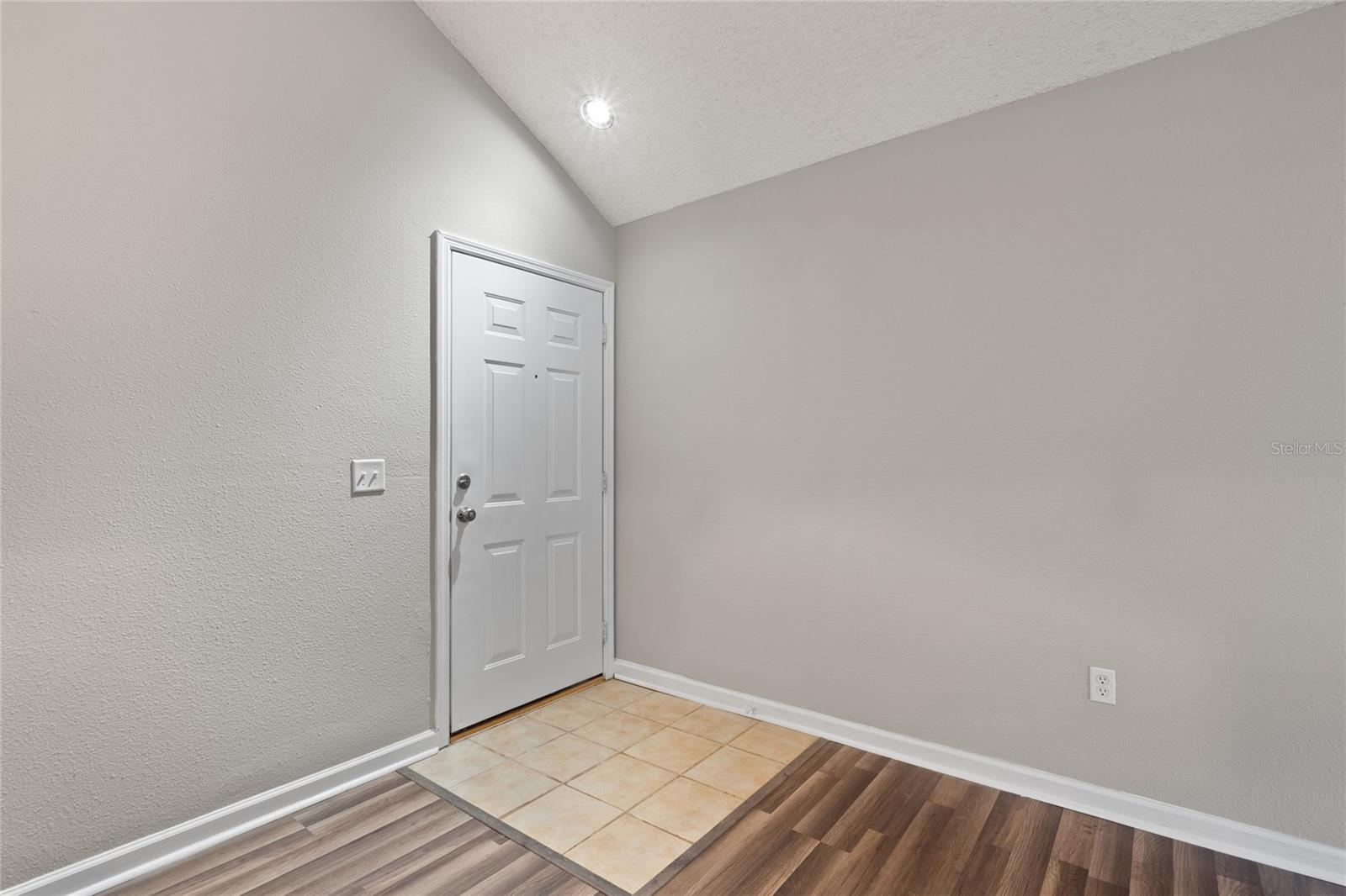 Enter this condo that has tile or laminate throughout