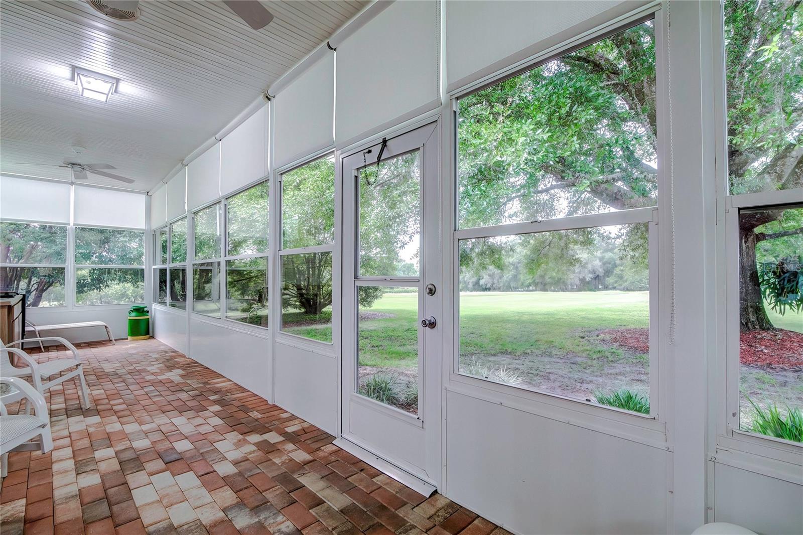 Enclosed Porch Adorned with Brick Pavers