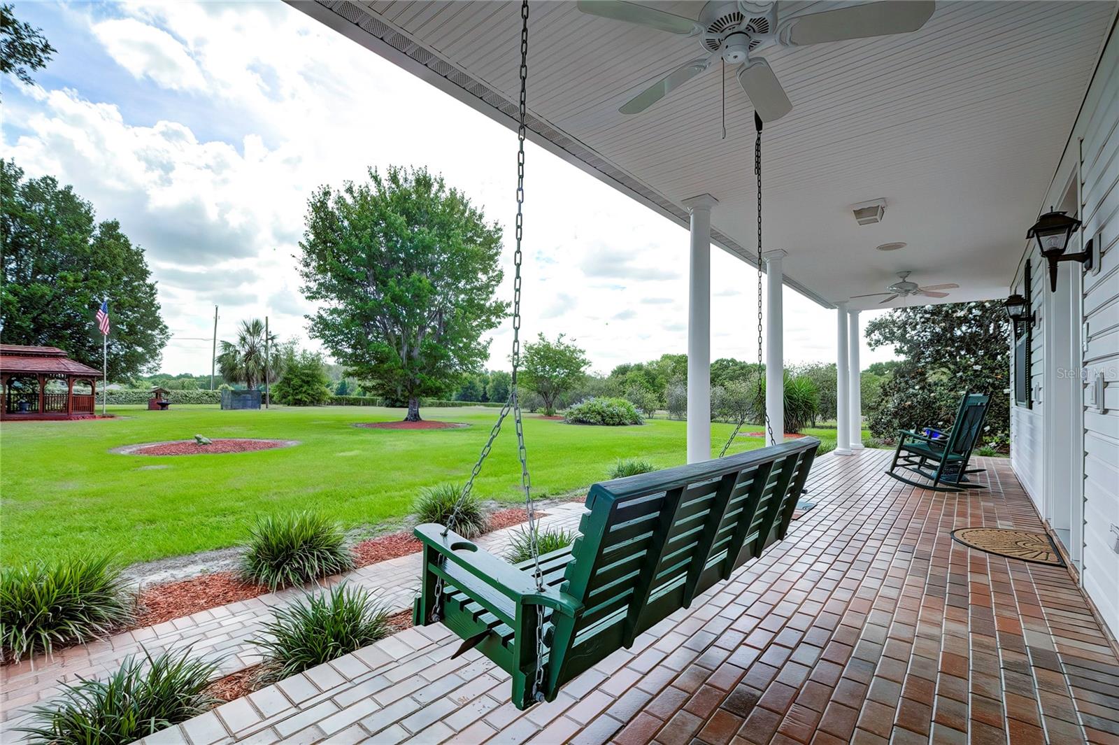 Rocking Chair Front Porch Adorned with Brick Pavers