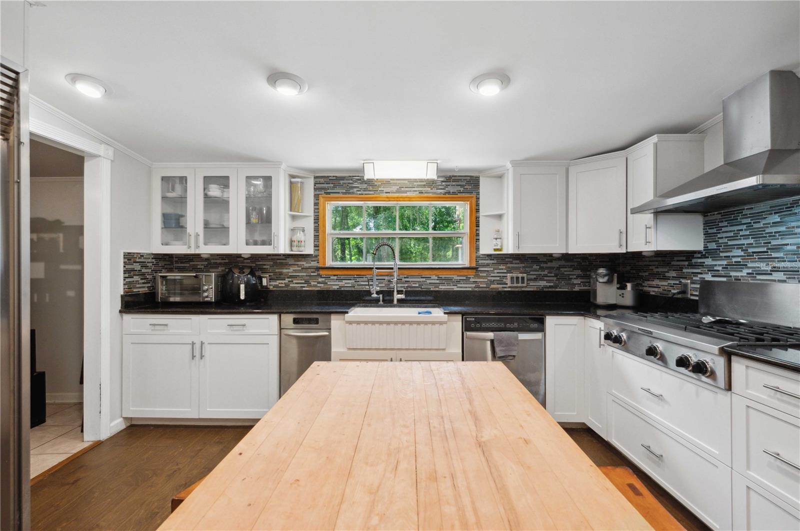 Kitchen with trash compactor