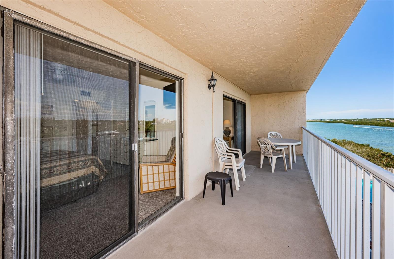 Step out of the Primary Suite and onto the waterfront balcony!
