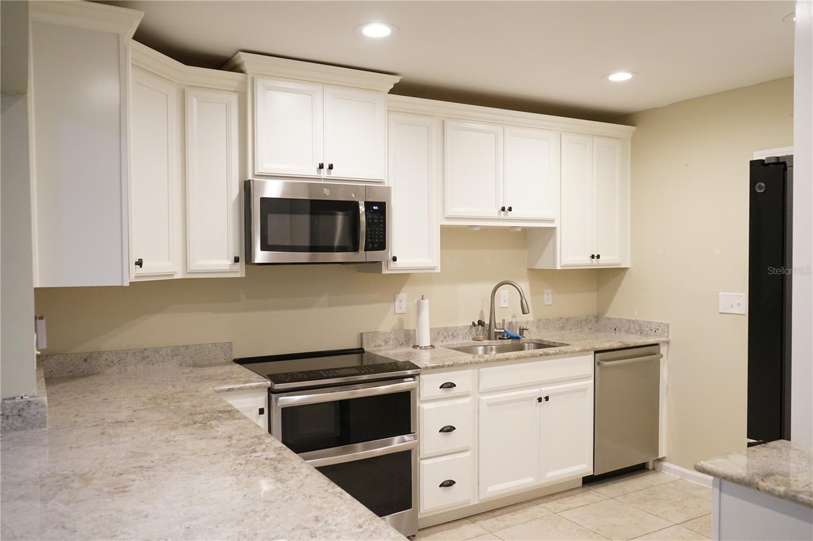 stainless appliance and taller cabinets