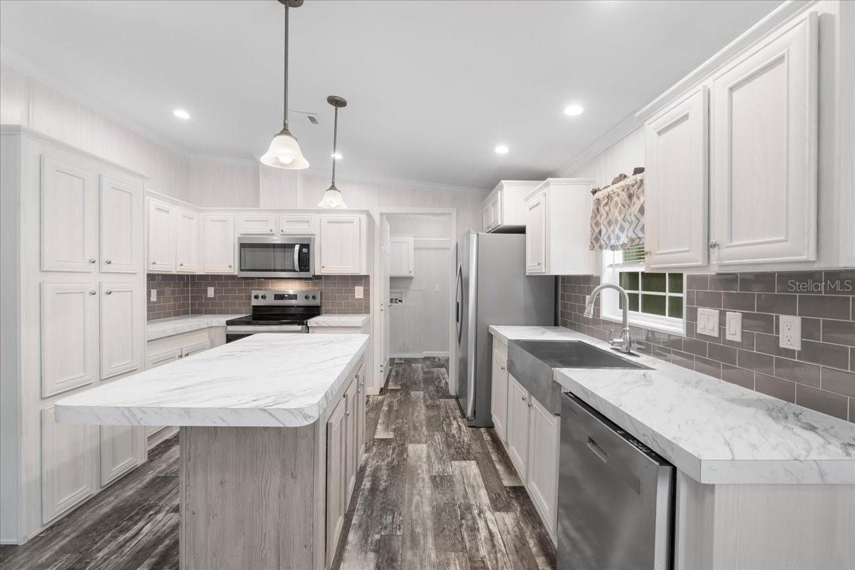 Kitchen w/view of Food Pantry & Laundry Room