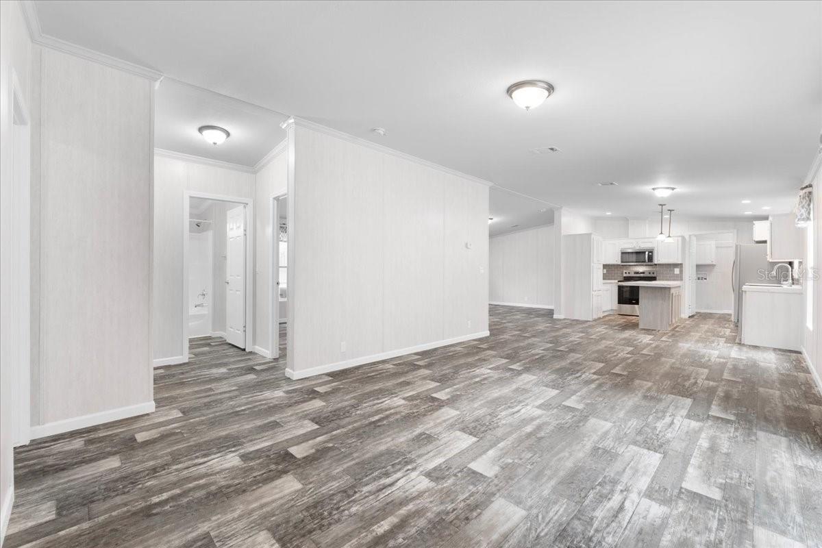 Family Room w/view of Guest Bathroom Entry, Dinette, & Kitchen