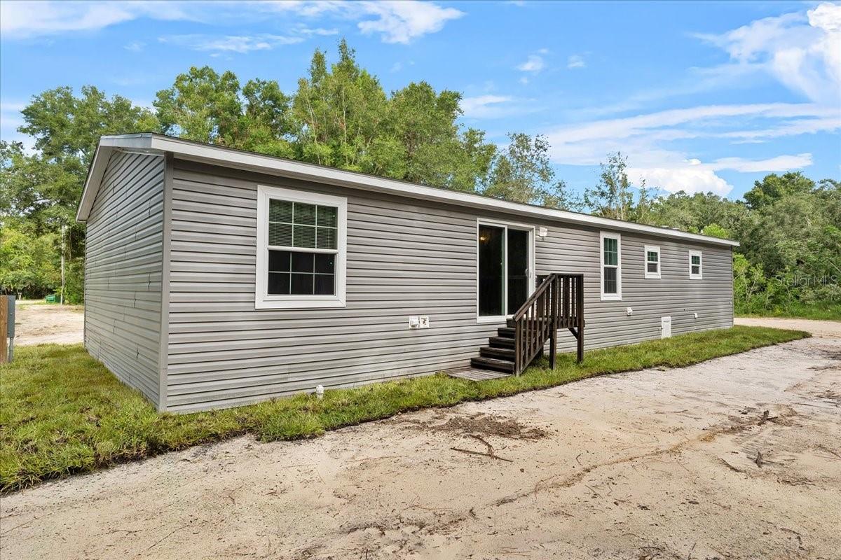 Rear Left of Home w/Sliding Glass Door for Rear Entry