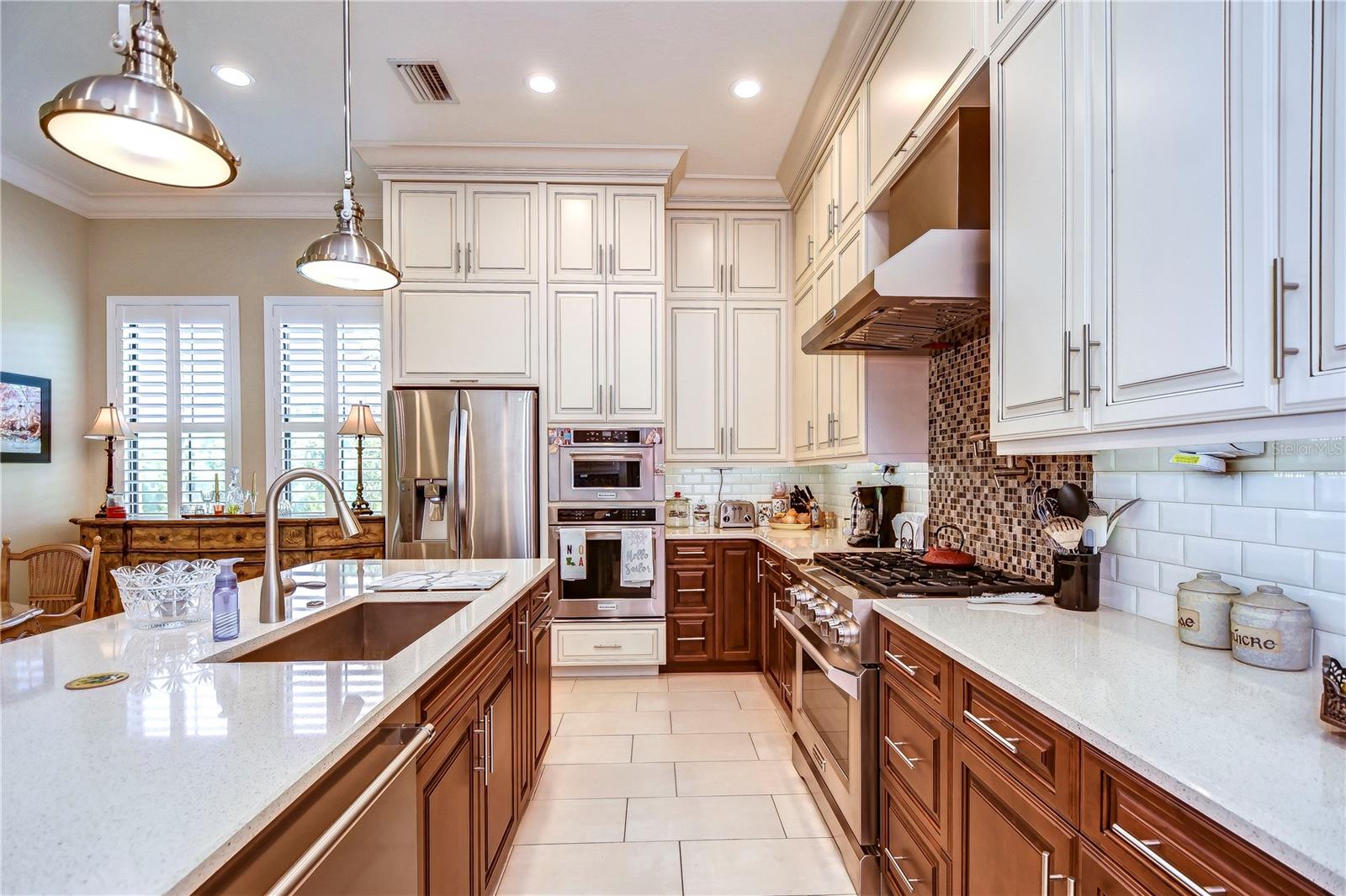 Beautiful kitchen boasting granite countertops, stainless steel appliances, and under cabinet lighting!