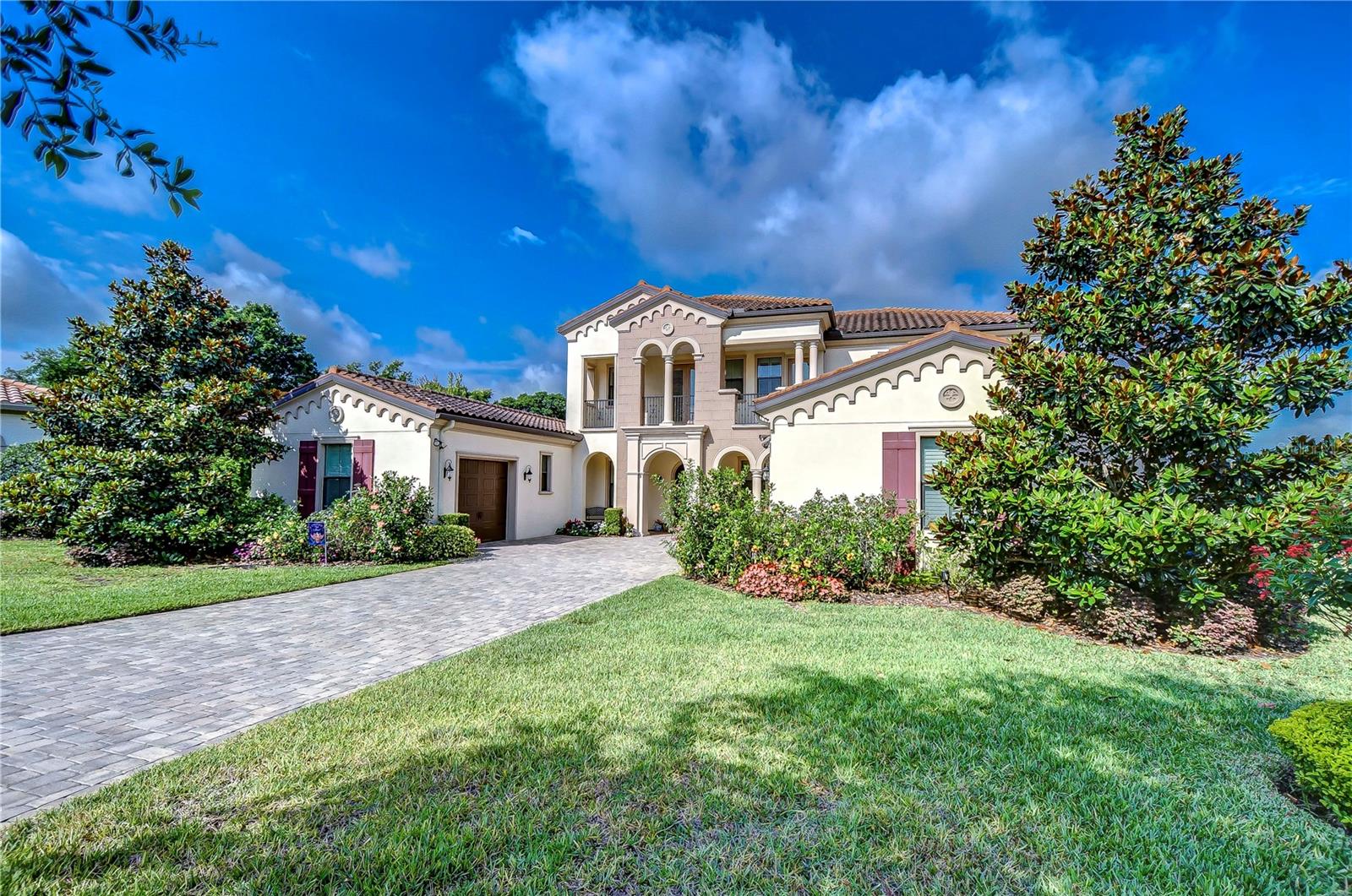 beautiful curb appeal with tropical landscaping!