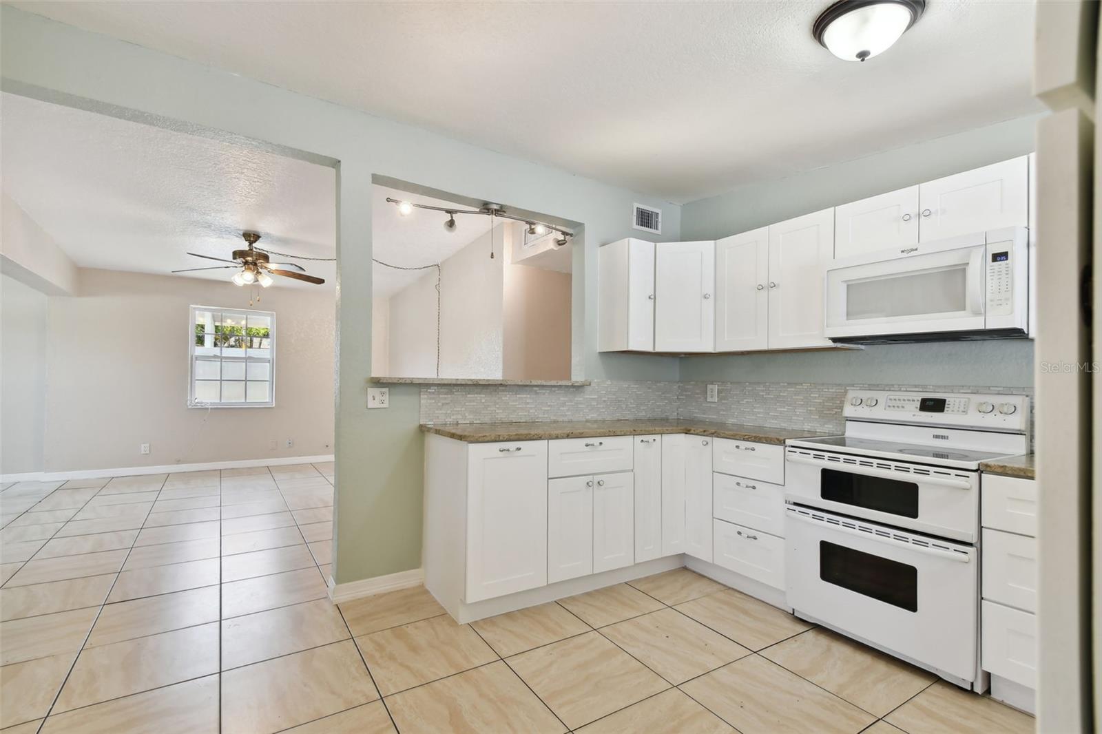Plenty of kitchen cabinets and counter space to suit the pickiest cooks. Built-in pantry.