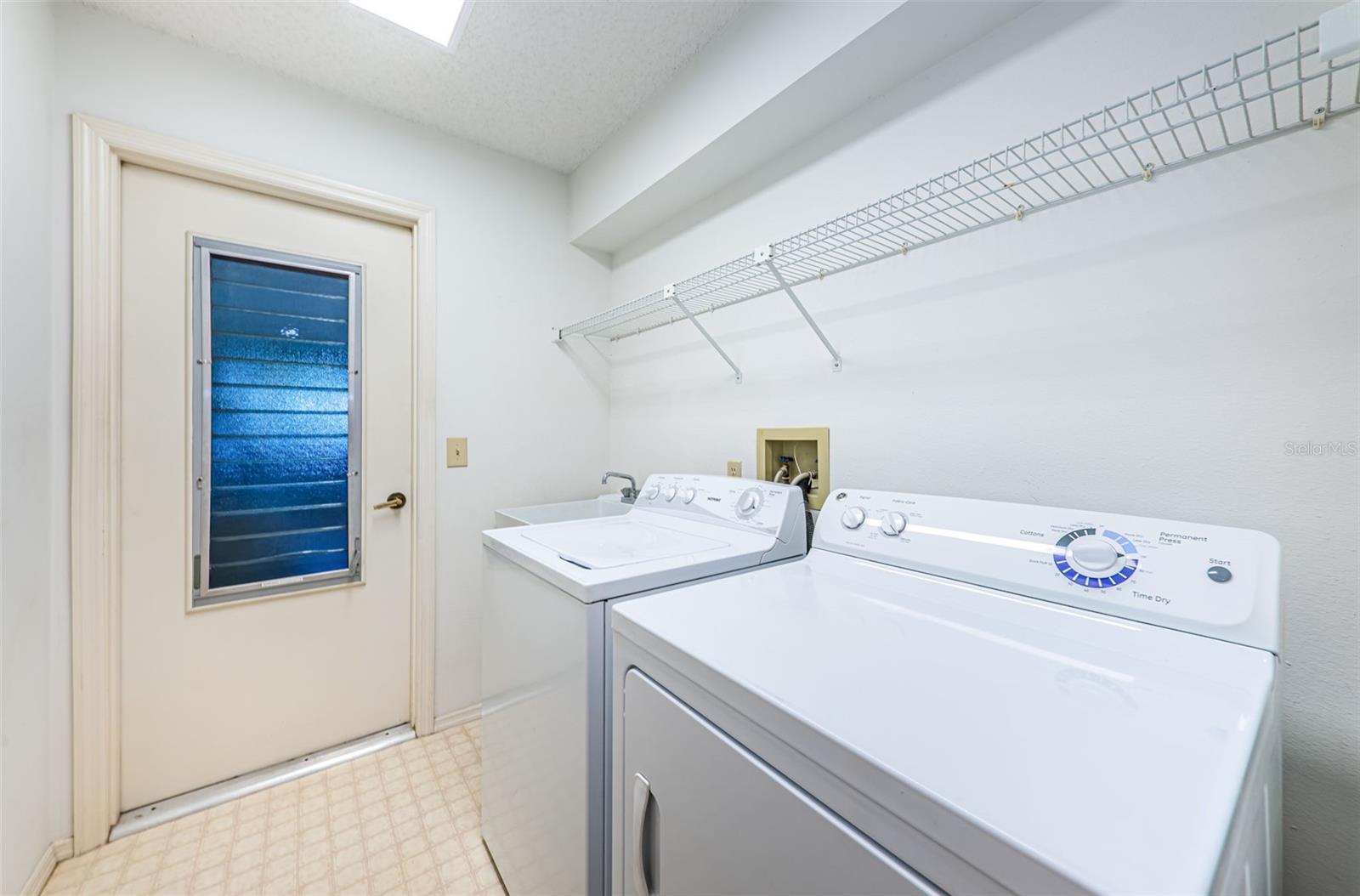 Laundry room includes washer and dryer - laundry sink