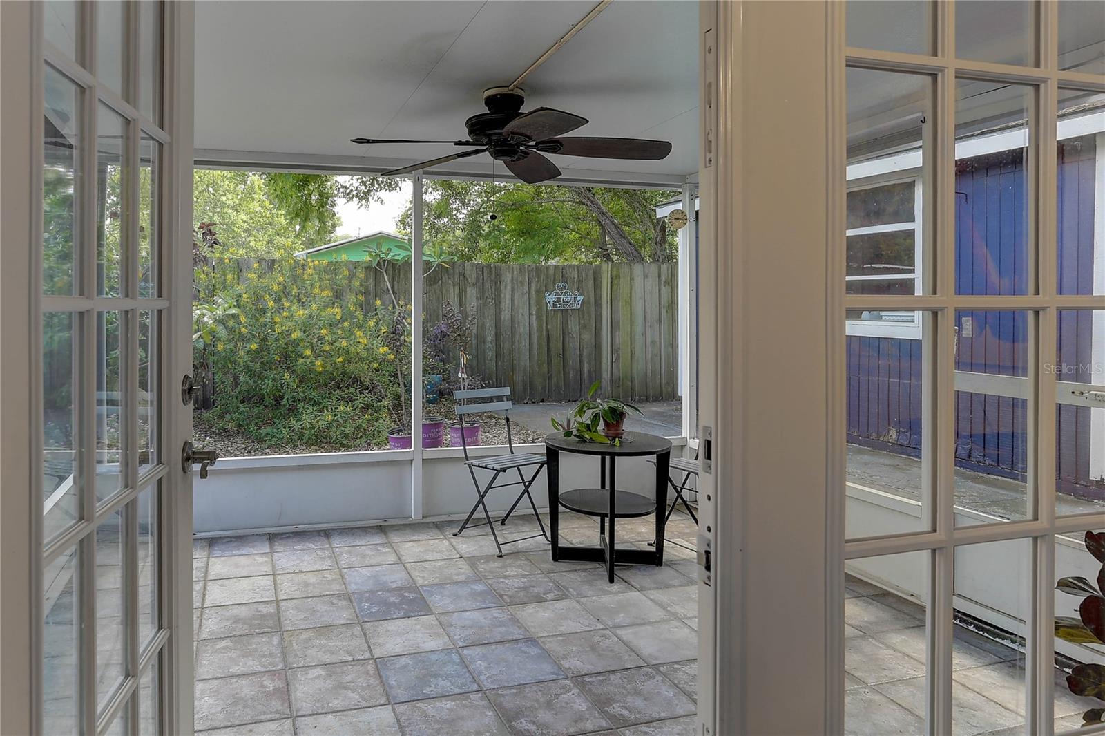 Nice sized screened porch with ceiling fan