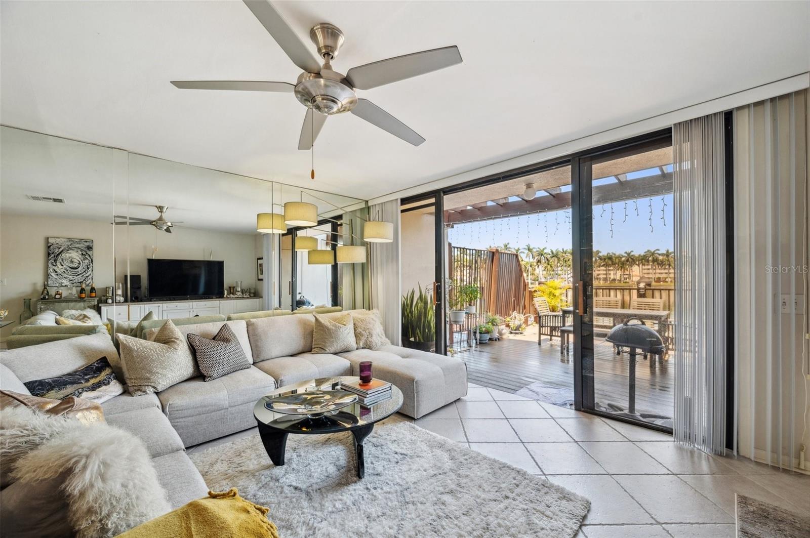 View living to sliding doors to large patio with outdoor storage !