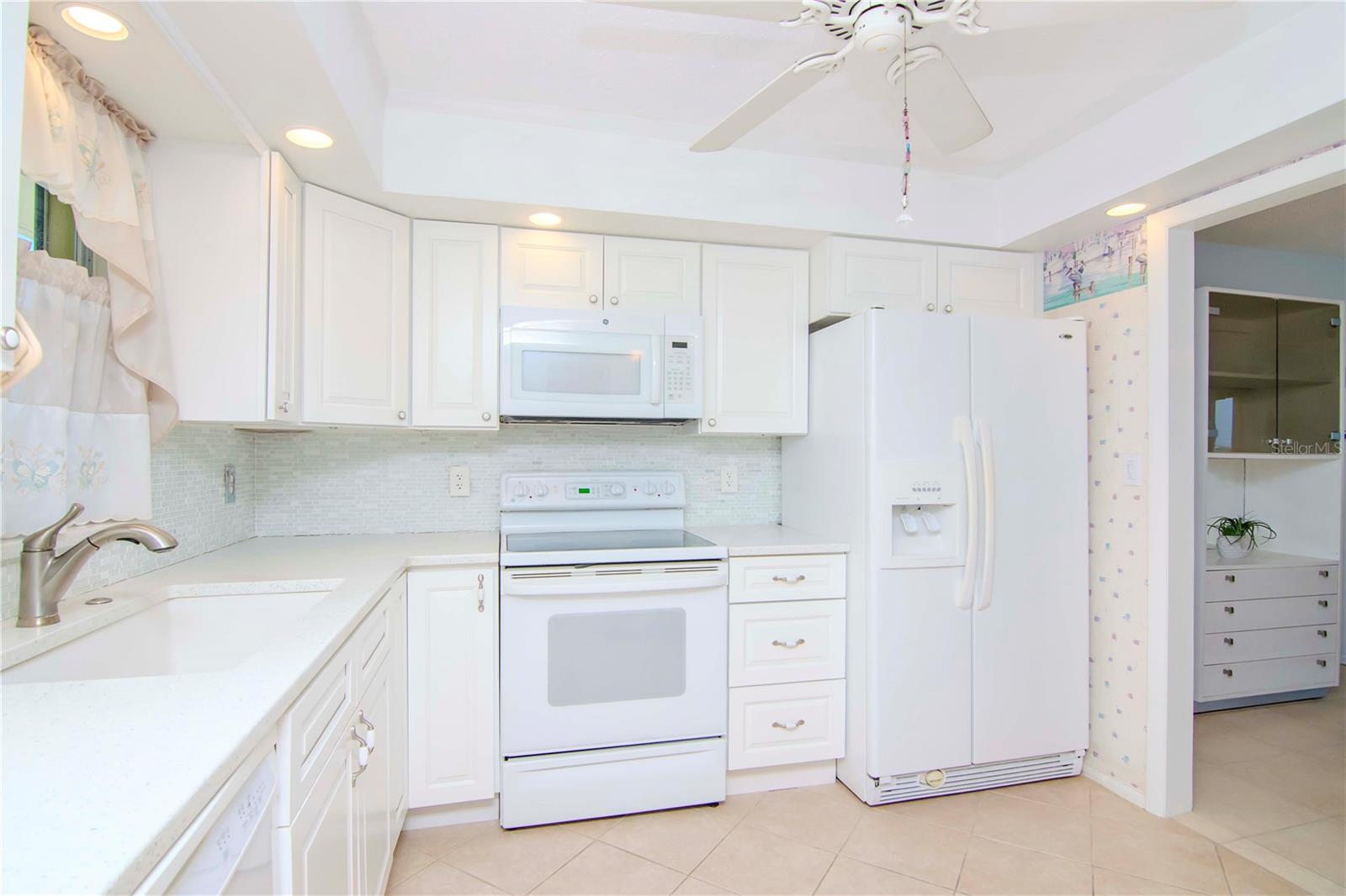 UPDATED CABINETS WITH QUARTZ COUNTER TOPS