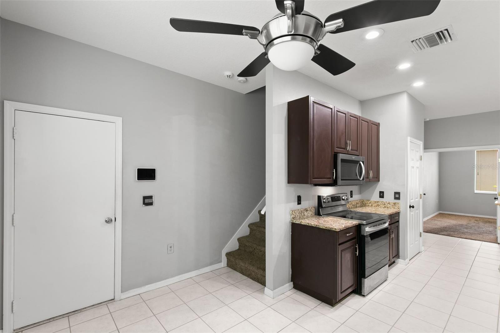 Door to garage/ Stairway to loft bonus room