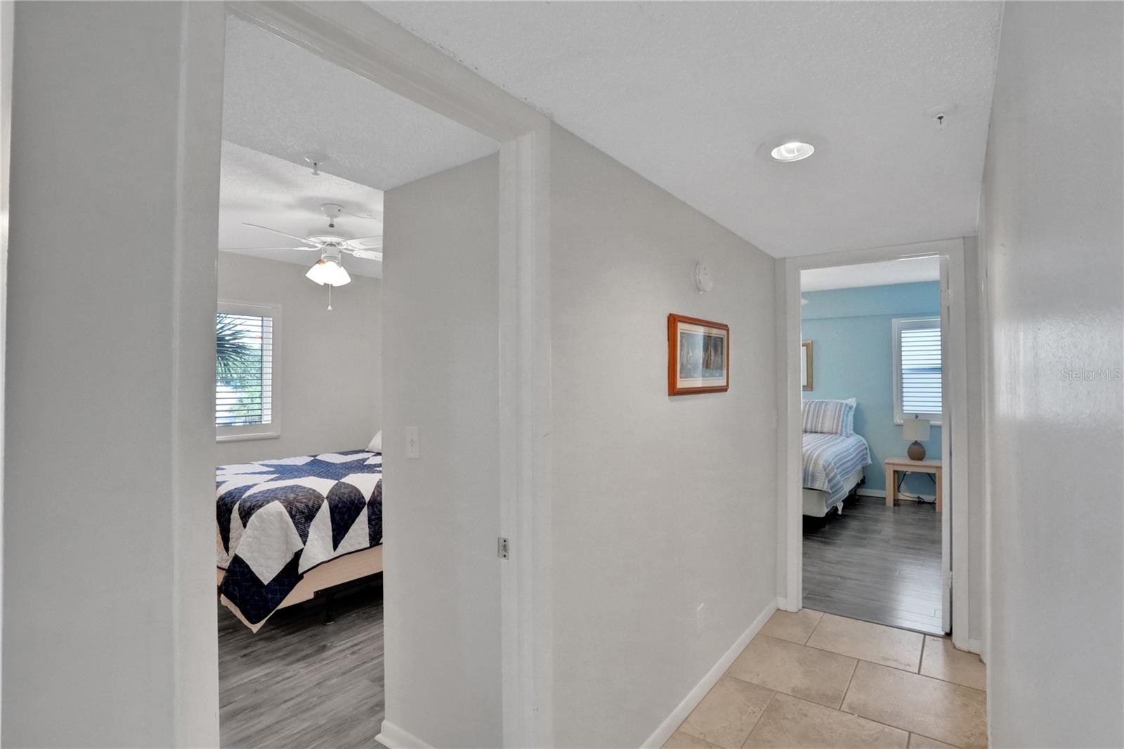 Hallway to second bedroom and primary bedroom