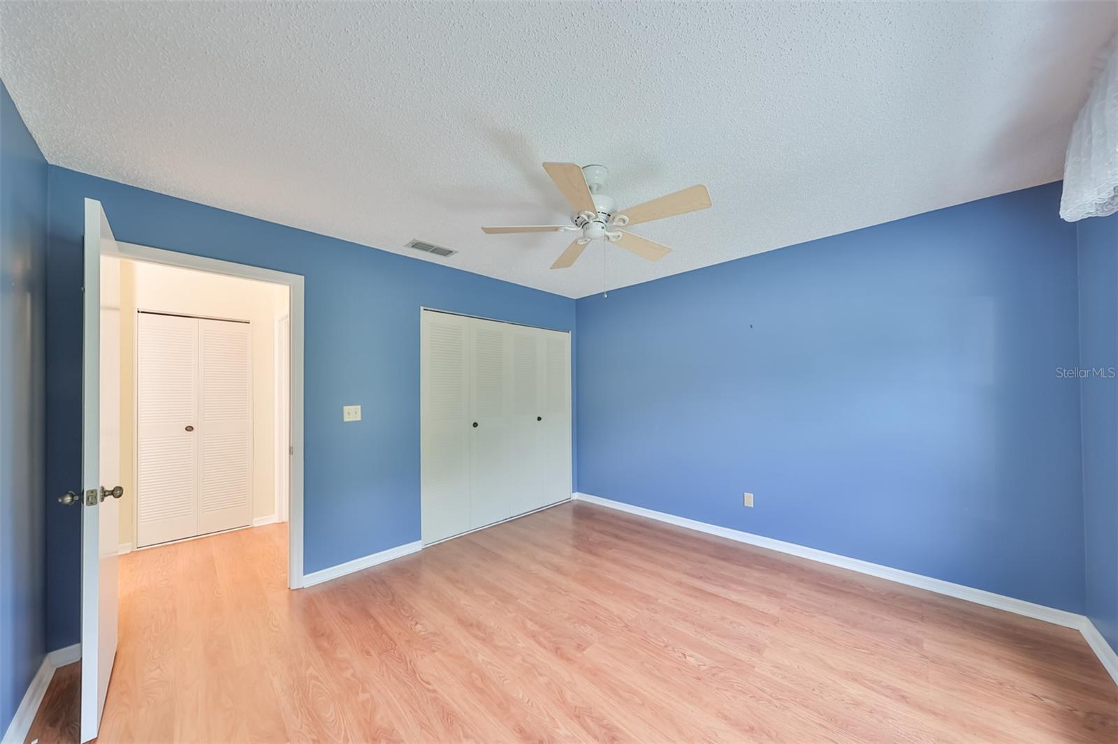 2nd Bedroom leading into the hallway. Bath on the right.