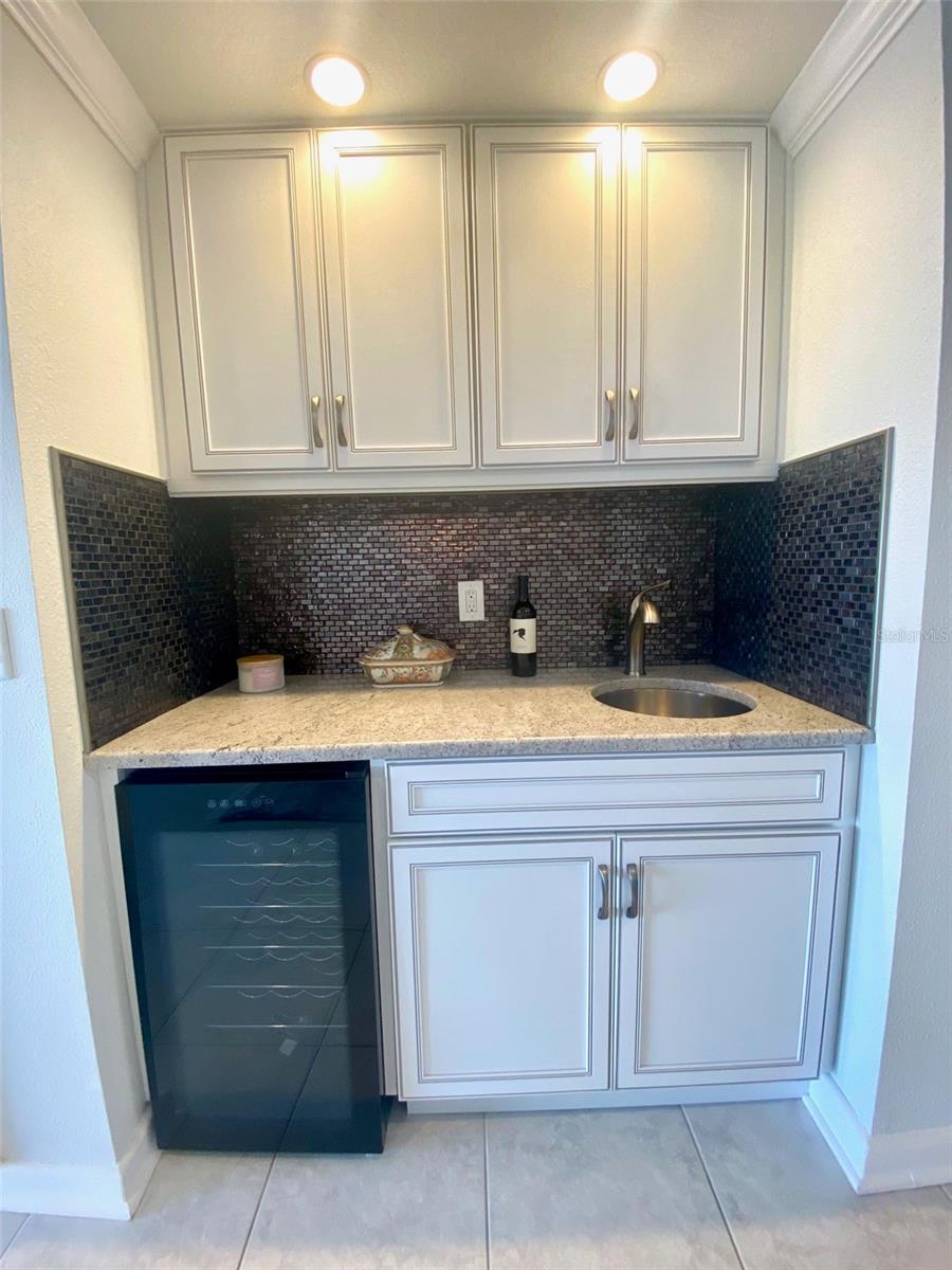 recessed wet bar and wine cooler with recessed lighting