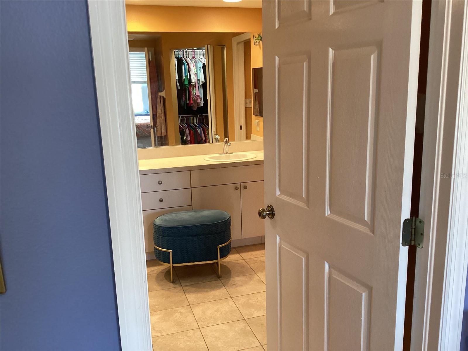 Ensuite bathroom with two walking closets