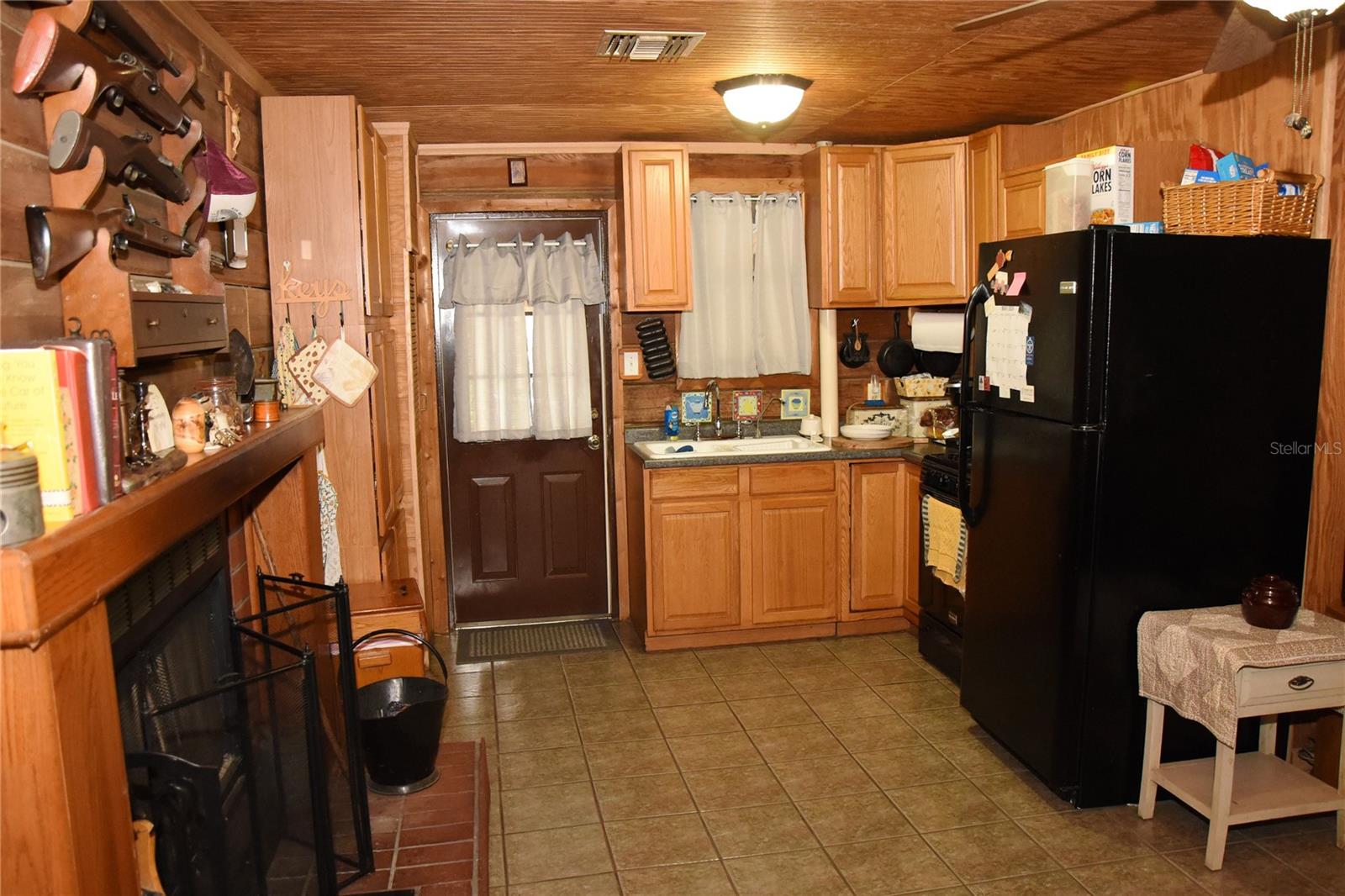 Kitchen and living area have classic fireplace