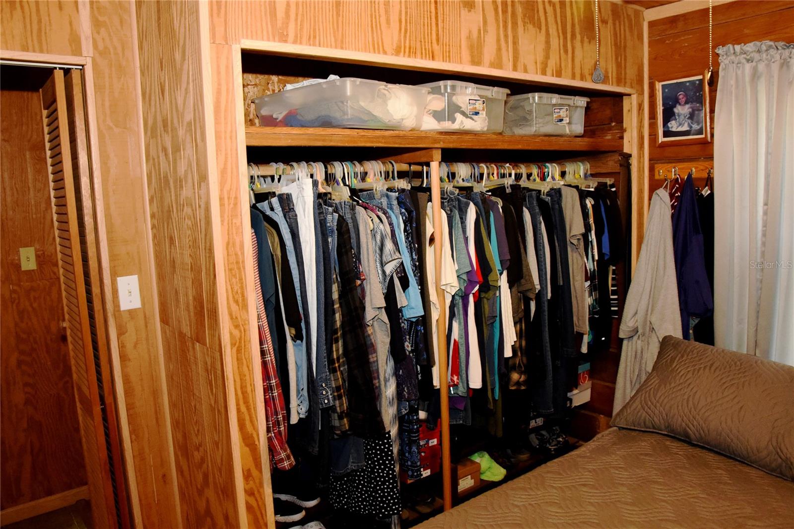 Owners closet and door to bathroom