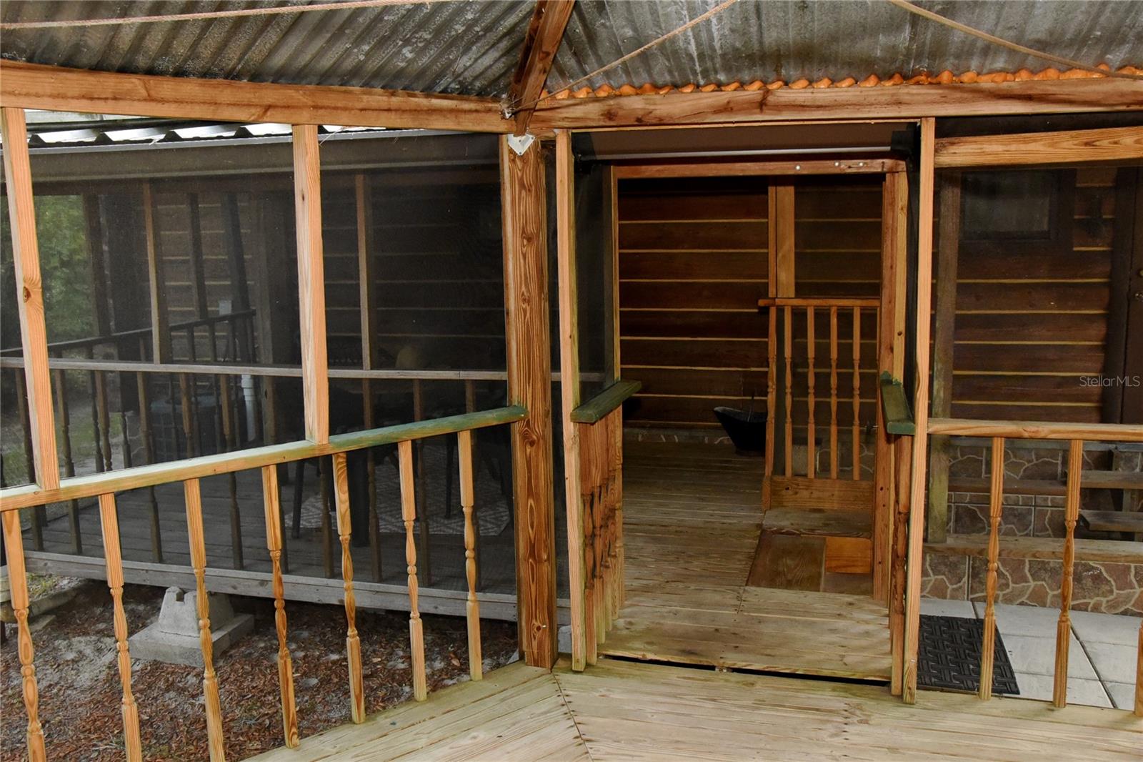 Back patio overlooks gazebo and woods