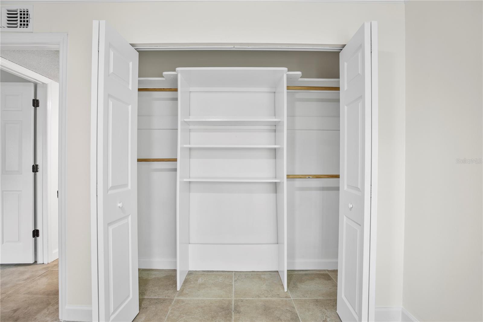 Closet organizers in the 2nd bedroom enhance the storage capacity