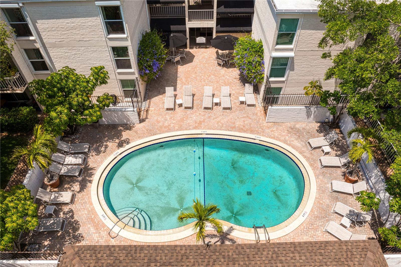 Bird's eye view of the pool with loads of outdoor seating.